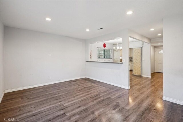 11052 1/2 Mcgirk Ave, El Monte, CA 91731 - unfurnished living room featuring a chandelier, recessed lighting, and wood finished floors