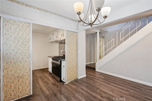 11052 1/2 Mcgirk Ave, El Monte, CA 91731 - kitchen featuring gas range, dark wood-style flooring, a chandelier, under cabinet range hood, and white cabinets