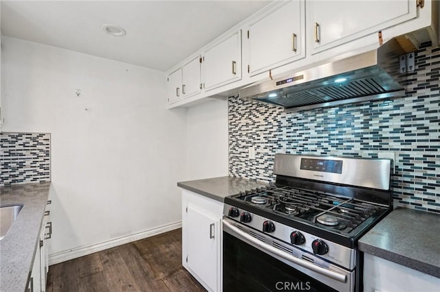 11052 1/2 Mcgirk Ave, El Monte, CA 91731 - kitchen featuring stainless steel range with gas cooktop, decorative backsplash, under cabinet range hood, white cabinetry, and dark wood-style floors
