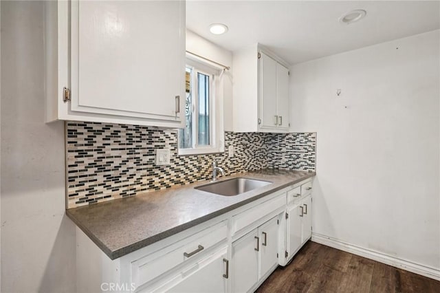 11052 1/2 Mcgirk Ave, El Monte, CA 91731 - kitchen with white cabinets, tasteful backsplash, dark wood-style floors, dark countertops, and recessed lighting