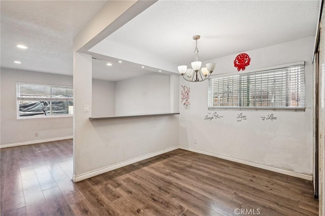 11052 1/2 Mcgirk Ave, El Monte, CA 91731 - unfurnished dining area with wood finished floors, a chandelier, recessed lighting, and a textured ceiling