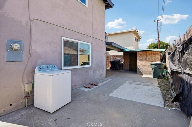 11052 1/2 Mcgirk Ave, El Monte, CA 91731 - view of home's exterior featuring washer / clothes dryer, a patio area, and stucco siding