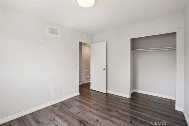 11052 1/2 Mcgirk Ave, El Monte, CA 91731 - unfurnished bedroom with wood finished floors and a closet