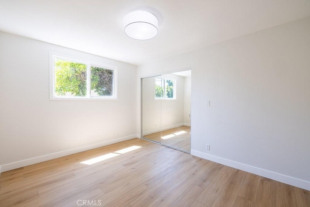 7830 Fairchild Ave, Winnetka, CA 91306 - unfurnished bedroom featuring light wood-style flooring and a closet