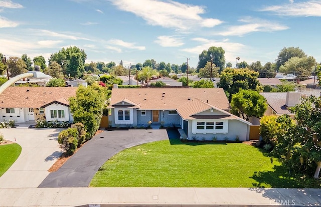 7830 Fairchild Ave, Winnetka, CA 91306 - view of front of house with a front yard, asphalt driveway, and a residential view
