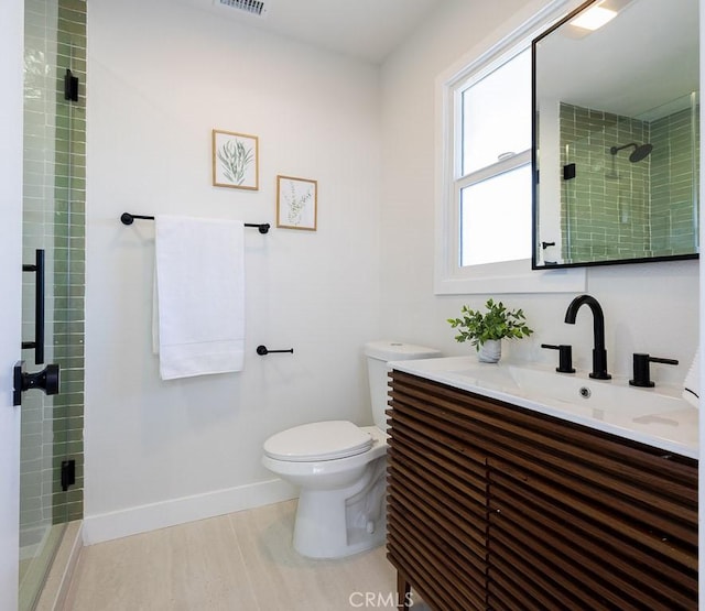 7830 Fairchild Ave, Winnetka, CA 91306 - bathroom with vanity, a stall shower, and wood finished floors