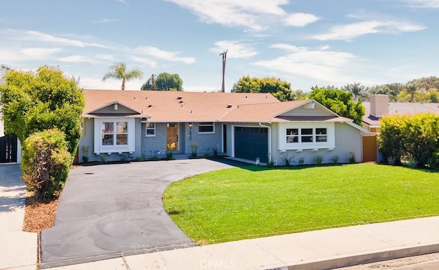 7830 Fairchild Ave, Winnetka, CA 91306 - ranch-style home featuring driveway, a garage, and a front yard