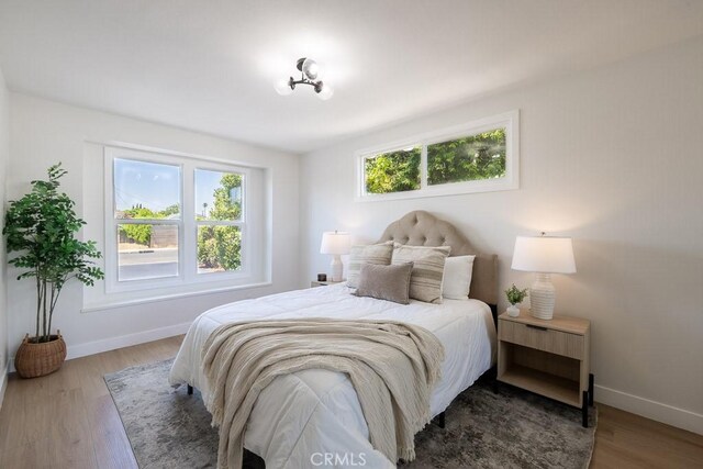 7830 Fairchild Ave, Winnetka, CA 91306 - bedroom with baseboards and wood finished floors