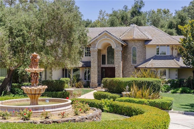 45200 Oak Manor Ct, Temecula, CA 92590 - view of front of house featuring stone siding, a tile roof, and stucco siding
