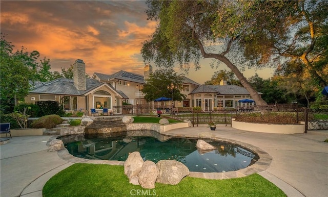 45200 Oak Manor Ct, Temecula, CA 92590 - pool at dusk with a patio