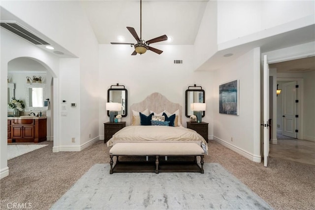 45200 Oak Manor Ct, Temecula, CA 92590 - bedroom featuring carpet, arched walkways, high vaulted ceiling, a ceiling fan, and connected bathroom