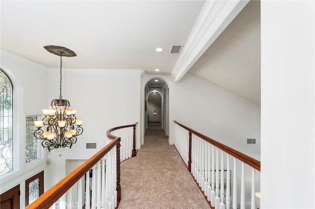 45200 Oak Manor Ct, Temecula, CA 92590 - corridor with arched walkways, a chandelier, an upstairs landing, carpet flooring, and ornamental molding