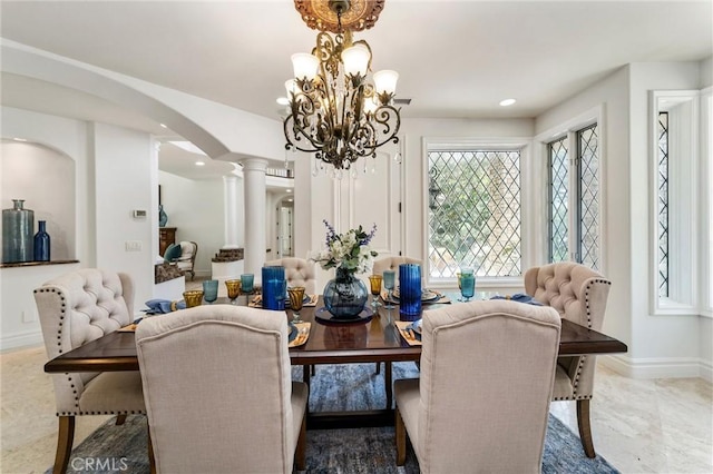 45200 Oak Manor Ct, Temecula, CA 92590 - dining room featuring ornate columns, a chandelier, recessed lighting, and arched walkways