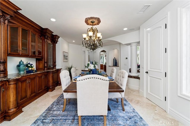 45200 Oak Manor Ct, Temecula, CA 92590 - dining space featuring arched walkways, a chandelier, plenty of natural light, recessed lighting, and ornate columns