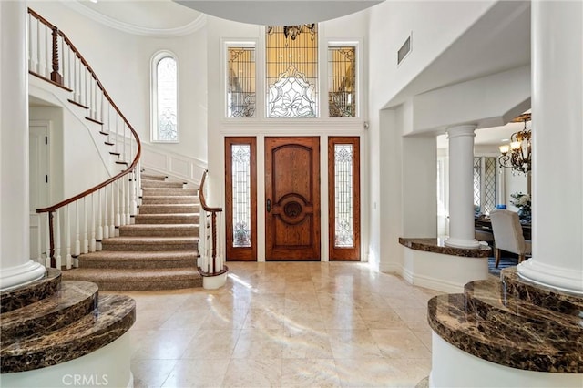 45200 Oak Manor Ct, Temecula, CA 92590 - entryway with a chandelier, a high ceiling, stairway, ornate columns, and marble tiled floors