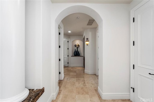 45200 Oak Manor Ct, Temecula, CA 92590 - corridor with arched walkways, stone finish floors, and recessed lighting
