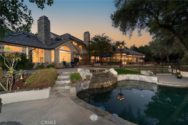 45200 Oak Manor Ct, Temecula, CA 92590 - pool at dusk featuring a patio area