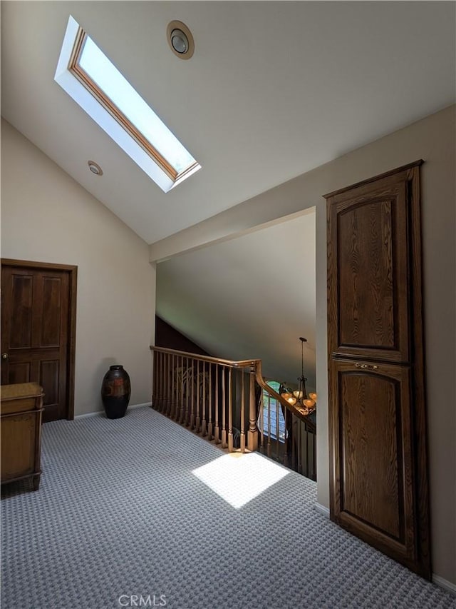 2622 Chauncy Pl, Riverside, CA 92506 - bonus room featuring lofted ceiling, a skylight, carpet flooring, and a chandelier