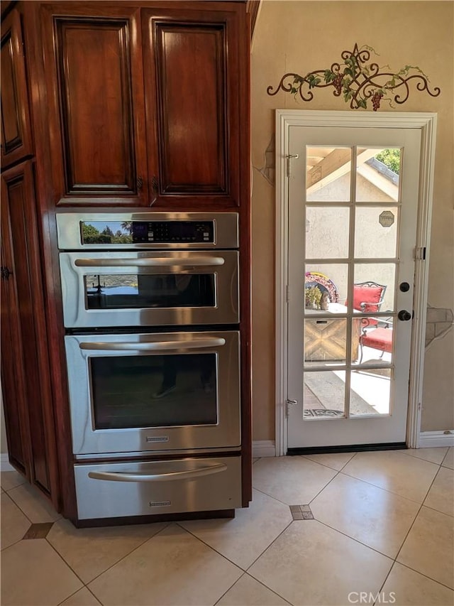 2622 Chauncy Pl, Riverside, CA 92506 - kitchen with a warming drawer, double oven, and light tile patterned floors