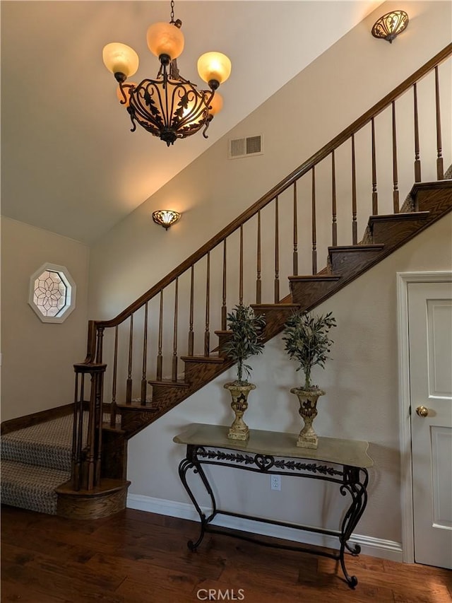 2622 Chauncy Pl, Riverside, CA 92506 - stairs featuring a chandelier and wood finished floors