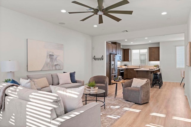 2333 Verano Way, Vista, CA 92081 - living room featuring light wood-style floors, a ceiling fan, and recessed lighting