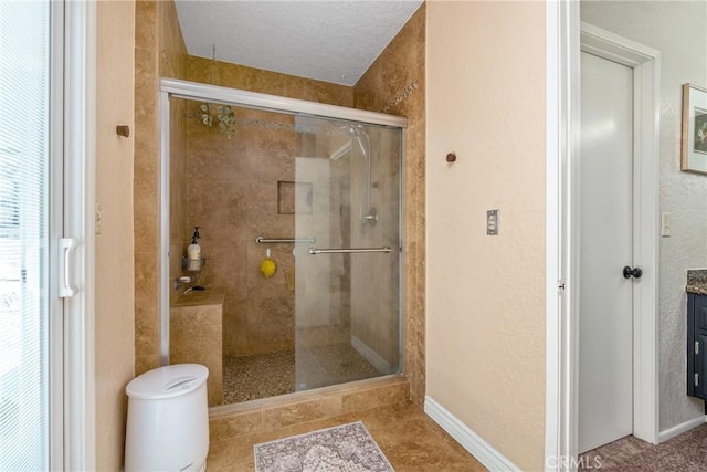 9292 Garden St, Rancho Cucamonga, CA 91701 - full bathroom featuring a stall shower, vanity, a textured wall, and a textured ceiling