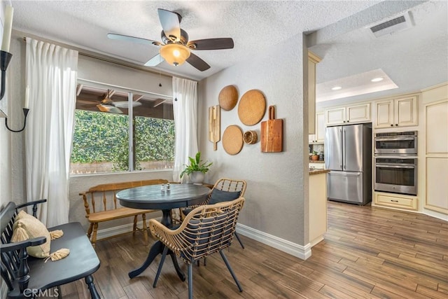 9292 Garden St, Rancho Cucamonga, CA 91701 - dining area featuring a textured wall, ceiling fan, a textured ceiling, and wood finished floors