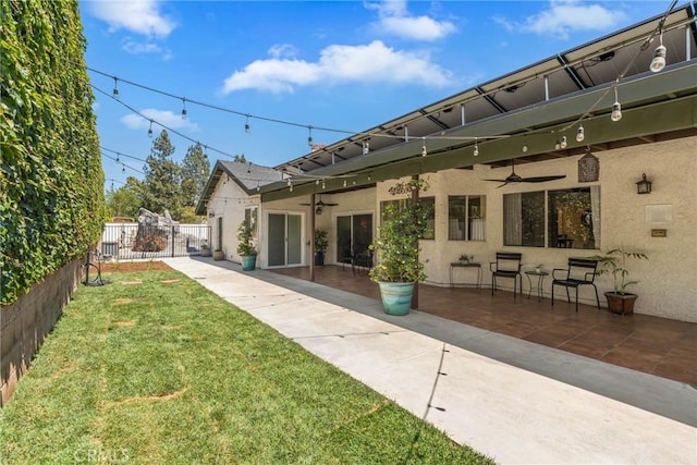 9292 Garden St, Rancho Cucamonga, CA 91701 - rear view of property with a ceiling fan, stucco siding, a patio area, and a gate