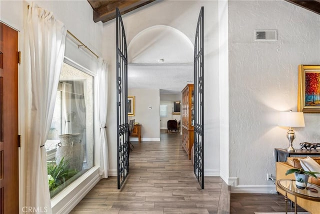 9292 Garden St, Rancho Cucamonga, CA 91701 - corridor with a textured wall and wood finished floors