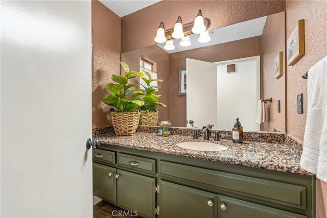 9292 Garden St, Rancho Cucamonga, CA 91701 - bathroom featuring vanity and a textured wall