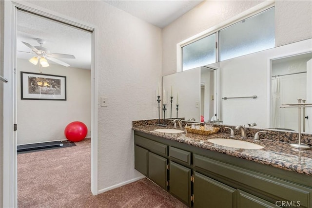 9292 Garden St, Rancho Cucamonga, CA 91701 - full bathroom with double vanity, a textured wall, a ceiling fan, and curtained shower