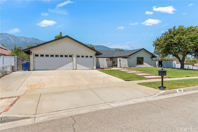 9292 Garden St, Rancho Cucamonga, CA 91701 - ranch-style home with a mountain view, driveway, an attached garage, and stucco siding