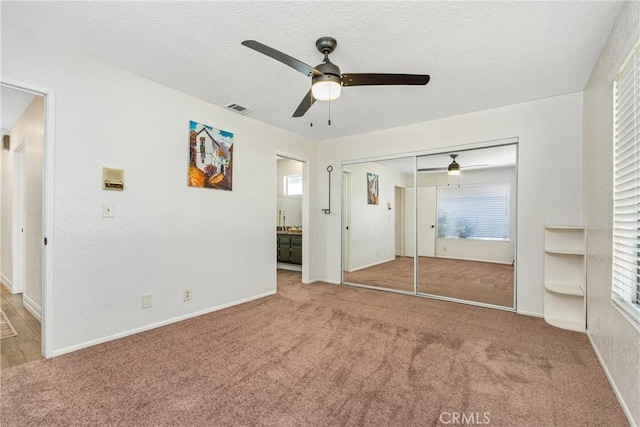 9292 Garden St, Rancho Cucamonga, CA 91701 - unfurnished bedroom with carpet floors, a closet, a textured ceiling, ceiling fan, and ensuite bath