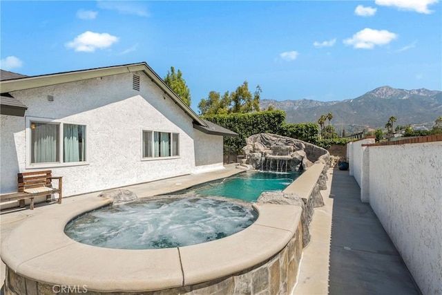 9292 Garden St, Rancho Cucamonga, CA 91701 - view of swimming pool with a mountain view and a pool with connected hot tub