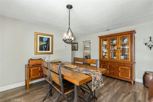 9292 Garden St, Rancho Cucamonga, CA 91701 - dining room with a chandelier, a textured ceiling, and dark wood finished floors