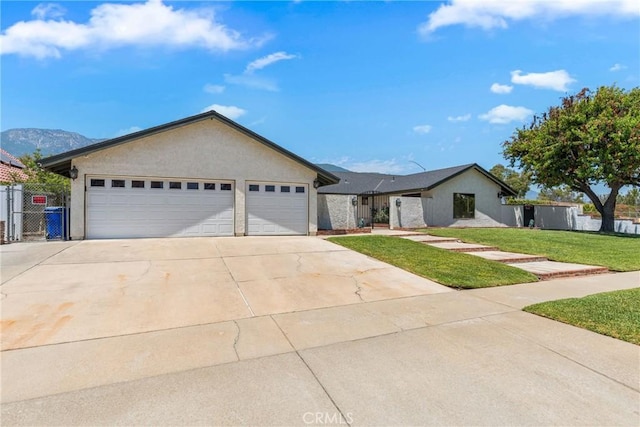 9292 Garden St, Rancho Cucamonga, CA 91701 - ranch-style house featuring concrete driveway, a garage, and stucco siding