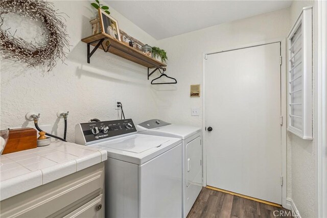 9292 Garden St, Rancho Cucamonga, CA 91701 - laundry room with dark wood-type flooring and independent washer and dryer