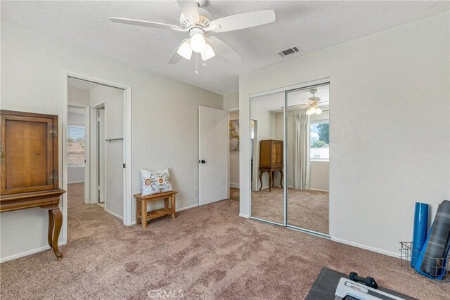 9292 Garden St, Rancho Cucamonga, CA 91701 - carpeted bedroom with a closet, a textured ceiling, and a ceiling fan