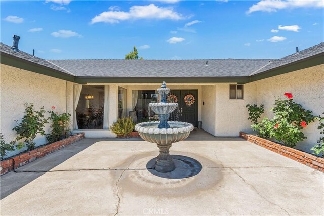 9292 Garden St, Rancho Cucamonga, CA 91701 - entrance to property featuring stucco siding, a patio, and roof with shingles