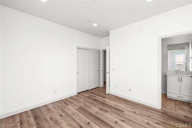 284 Novel, Irvine, CA 92618 - unfurnished bedroom featuring light wood finished floors, recessed lighting, and a closet
