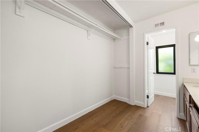 22526 Napa St, West Hills, CA 91304 - spacious closet featuring wood finished floors