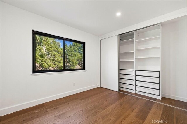 22526 Napa St, West Hills, CA 91304 - unfurnished bedroom with wood finished floors, a closet, and recessed lighting