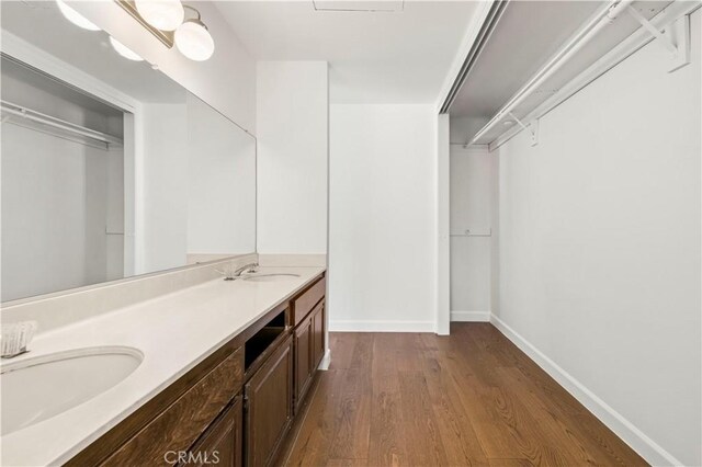 22526 Napa St, West Hills, CA 91304 - full bath with wood finished floors, double vanity, and a spacious closet