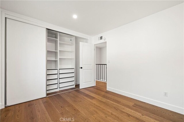 22526 Napa St, West Hills, CA 91304 - unfurnished bedroom featuring wood finished floors and a closet