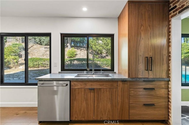 22526 Napa St, West Hills, CA 91304 - kitchen with dishwasher, wood finished floors, dark countertops, brown cabinetry, and recessed lighting