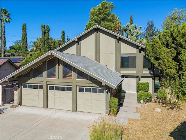 22526 Napa St, West Hills, CA 91304 - view of front of house featuring driveway and a garage