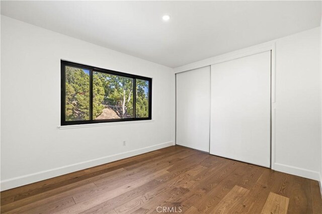 22526 Napa St, West Hills, CA 91304 - unfurnished bedroom with wood finished floors, a closet, and recessed lighting