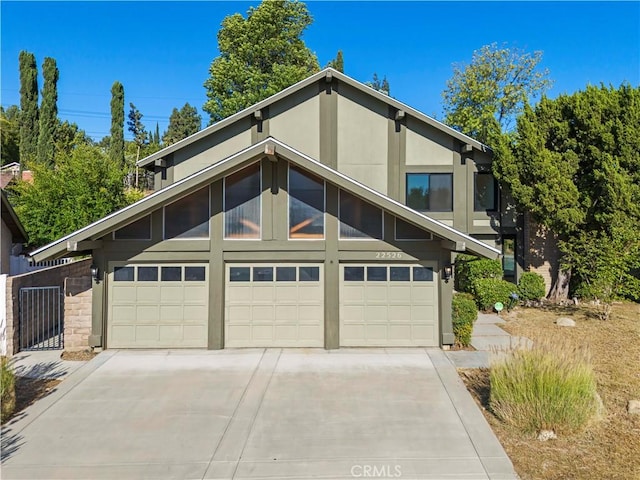 22526 Napa St, West Hills, CA 91304 - mid-century home with driveway, stucco siding, and a garage