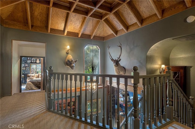 969 Oak Dr, Crestline, CA 92325 - corridor with a wooden ceiling with exposed beams, carpet flooring, and an upstairs landing