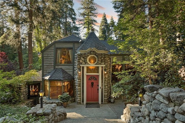 969 Oak Dr, Crestline, CA 92325 - view of front of home with stone siding and roof with shingles